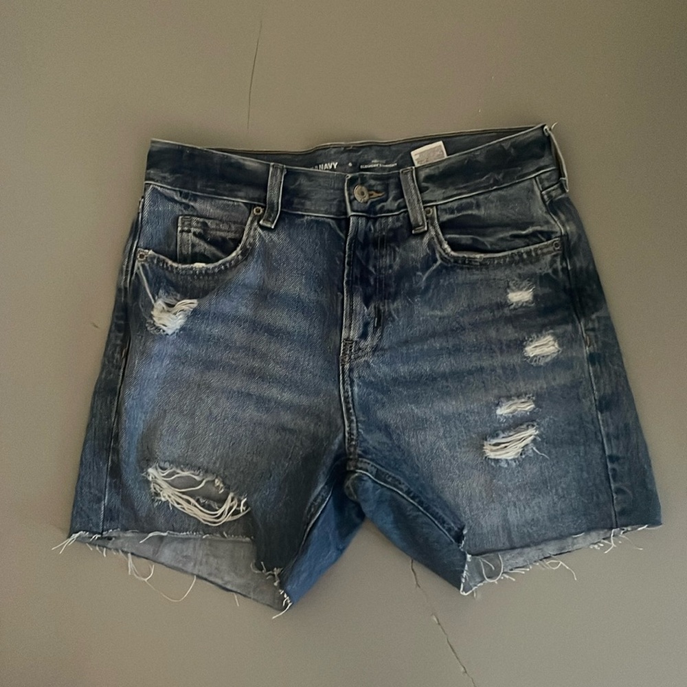 mid length blue ripped jean shorts